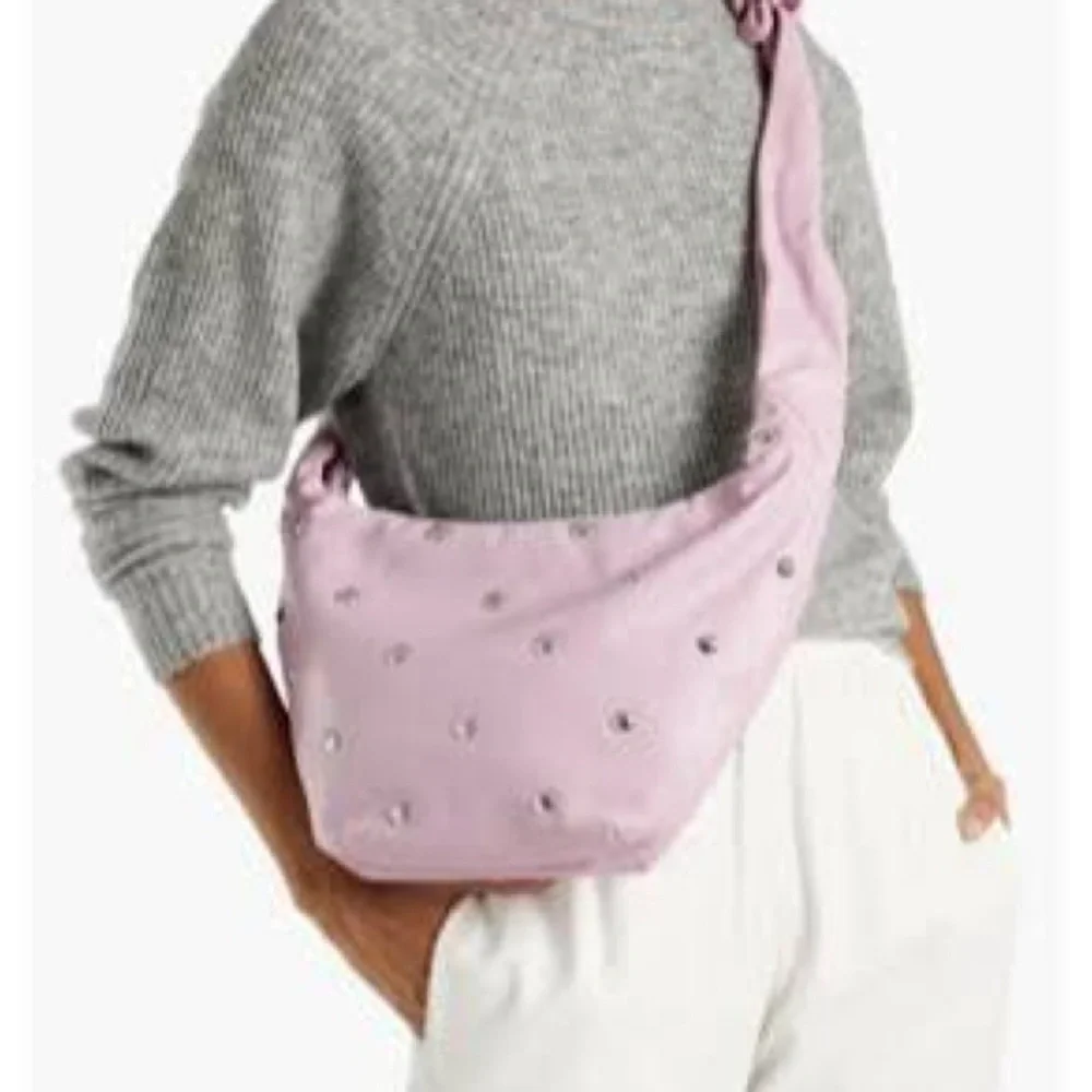 Maje “le bow bag” in black leather with silver studs
